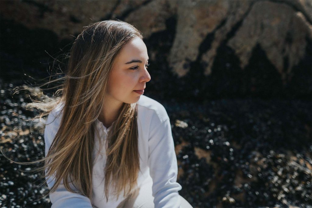 AVEN Communications strategist Jamie-Leigh Gonzales seen outdoors. She is looking off to the right of the photo