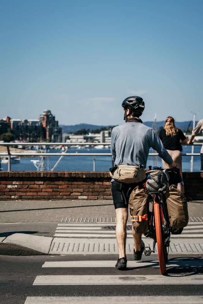 Nick crosses a street at Victoria waterfront harbour