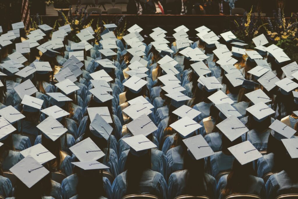 birdseye view of a crowd wearing graduation cap and gown