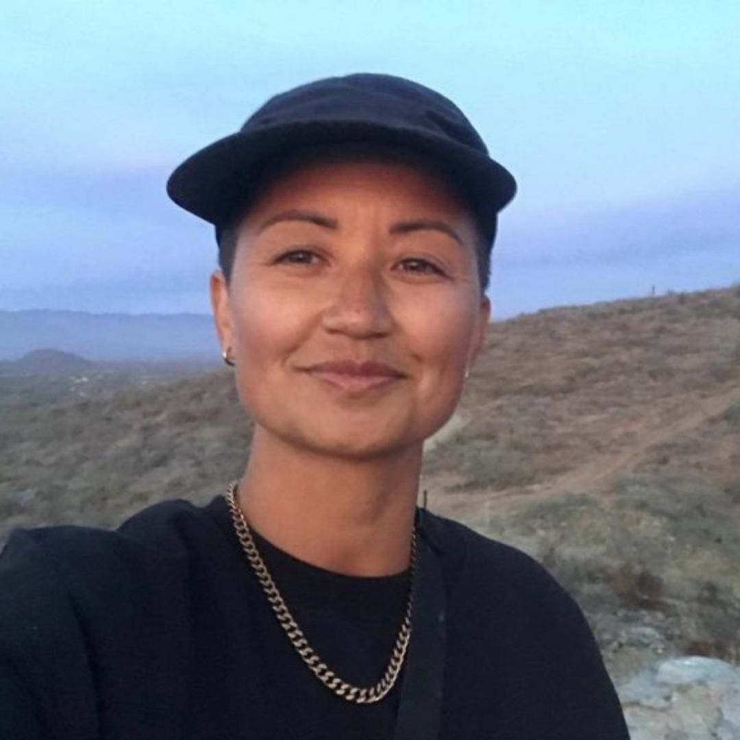 Jody smiling slightly at camera